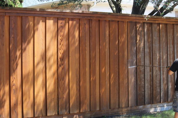 Beautifully stained cedar privacy fence in a Lubbock TX neighborhood